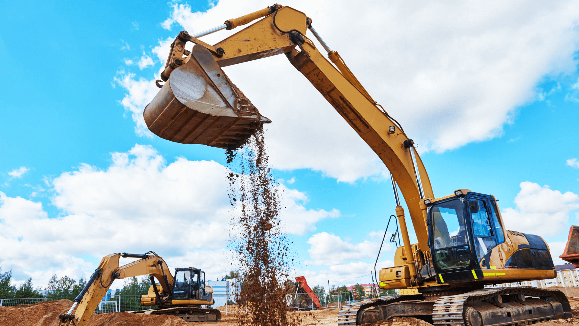 Two excavation diggers lifting dirt at construction site
