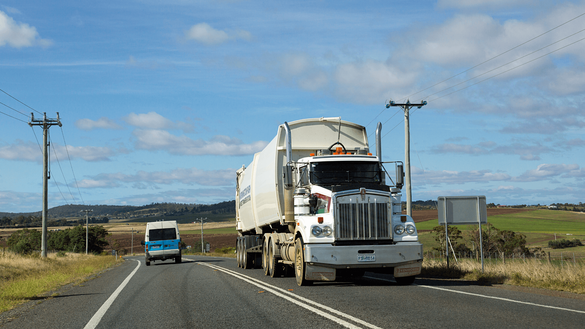 Truck driving near poles
