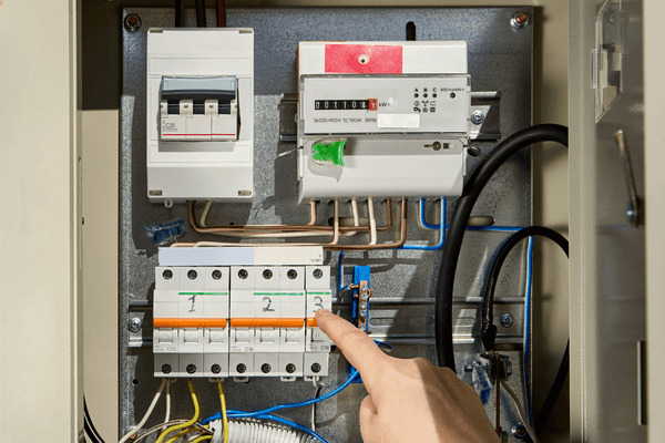 Pointing at electricity switchboard